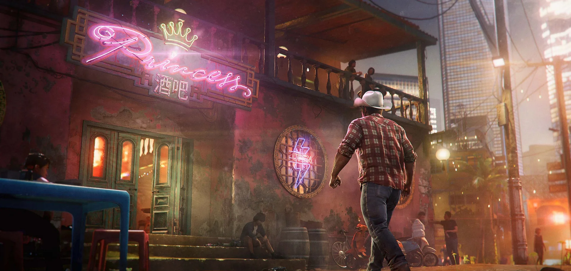 A narrow back street glowing with neon bar signs at night