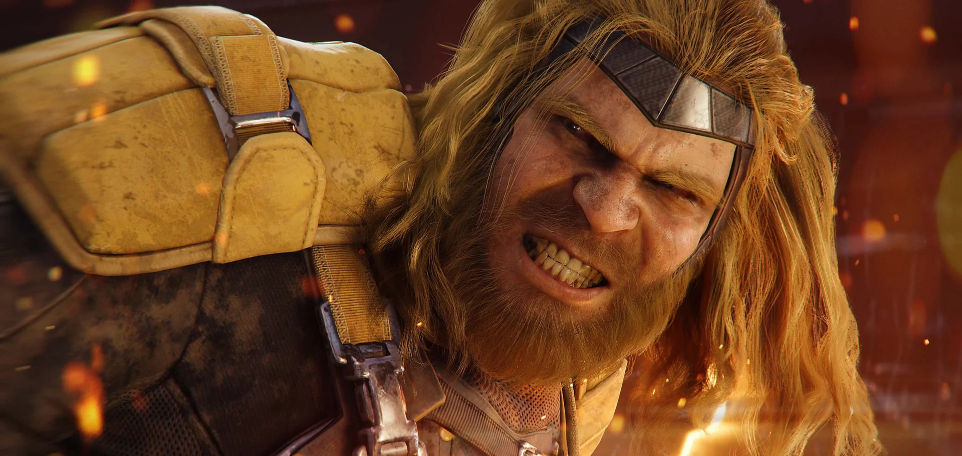 Sabretooth grins through the embers of a burning wreck